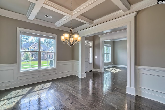 unfurnished dining area with beamed ceiling, dark hardwood / wood-style flooring, crown molding, and an inviting chandelier