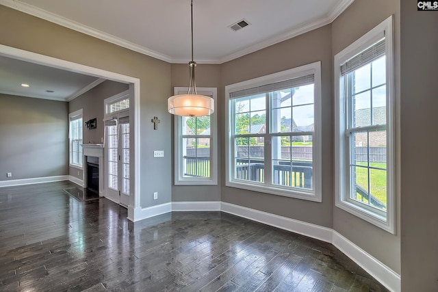 unfurnished dining area with crown molding and dark wood-type flooring