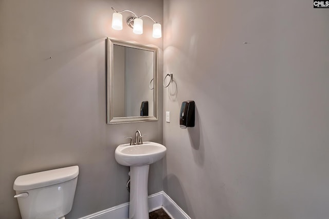 bathroom with sink and toilet