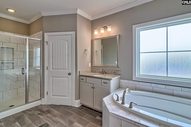 bathroom with vanity, crown molding, and independent shower and bath