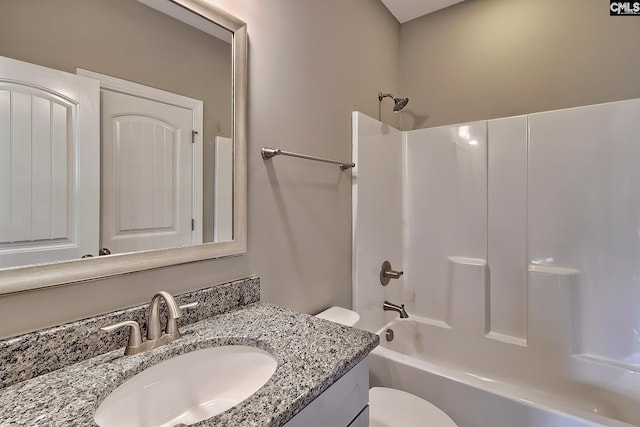 full bathroom featuring vanity, shower / bathtub combination, and toilet