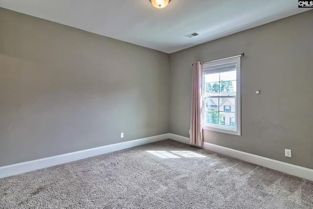 unfurnished room featuring carpet