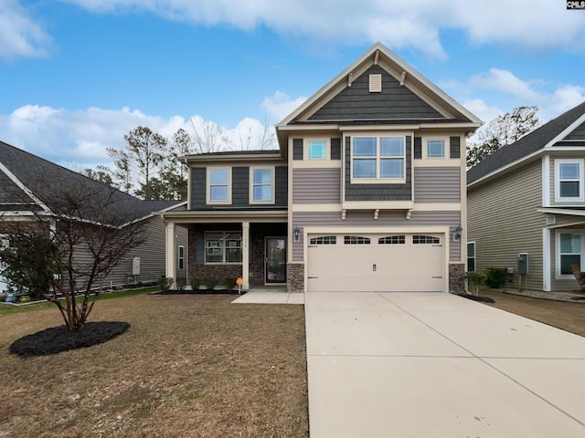 craftsman house with a garage