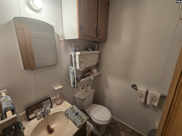 bathroom with toilet and sink