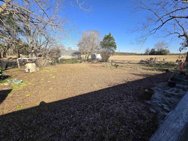 view of yard with a rural view