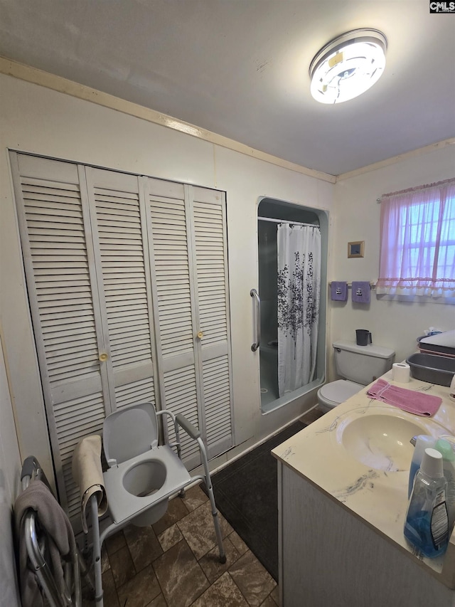 bathroom with vanity and toilet