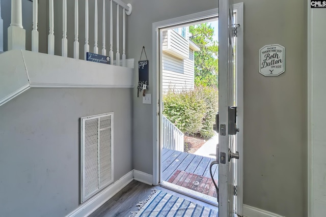 entryway with hardwood / wood-style floors