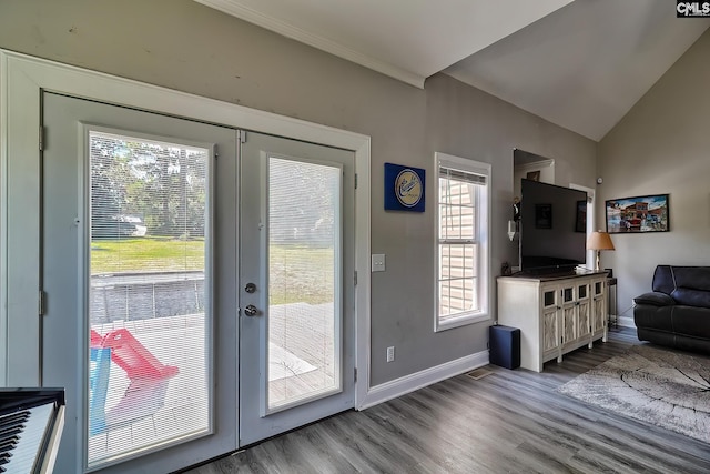 entryway with french doors, vaulted ceiling, and light wood-type flooring