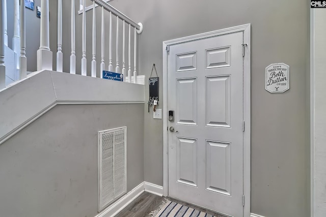 entrance foyer featuring dark hardwood / wood-style flooring