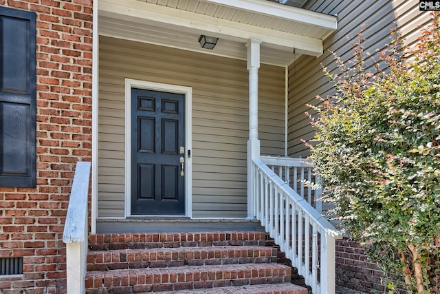 entrance to property with a porch