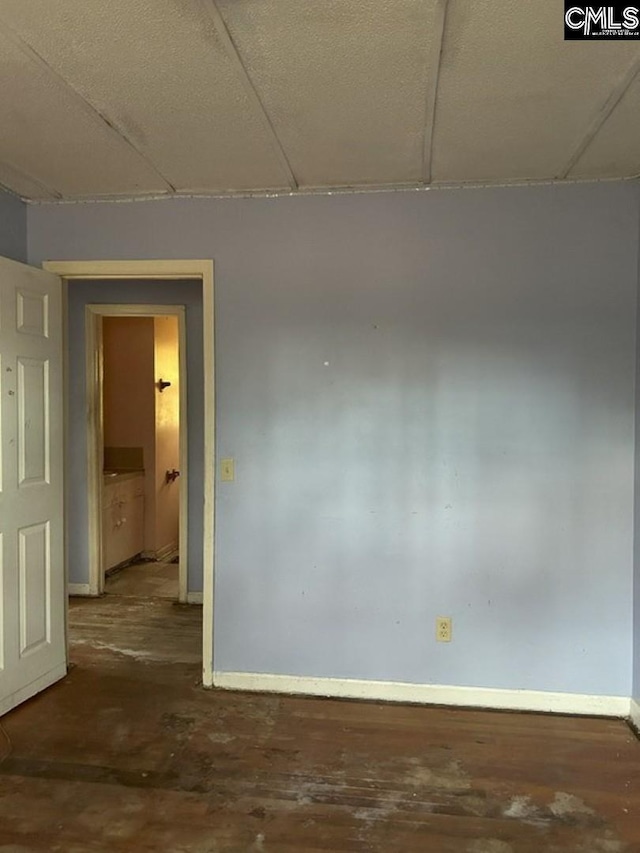 unfurnished room with a paneled ceiling