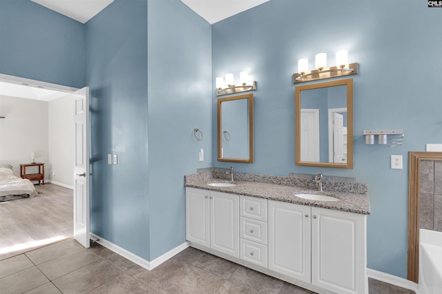 bathroom with tile patterned flooring and vanity