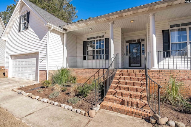 view of front facade featuring a porch and a garage