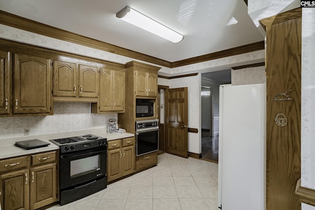 kitchen with crown molding, light tile patterned floors, and black appliances