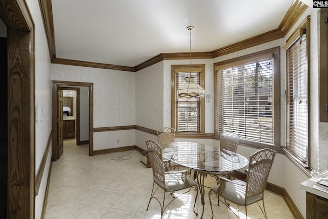 dining room featuring crown molding