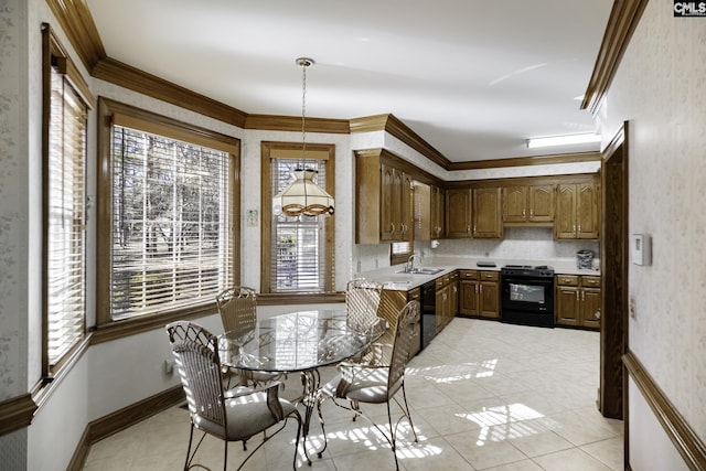 kitchen with crown molding, sink, black appliances, pendant lighting, and light tile patterned floors