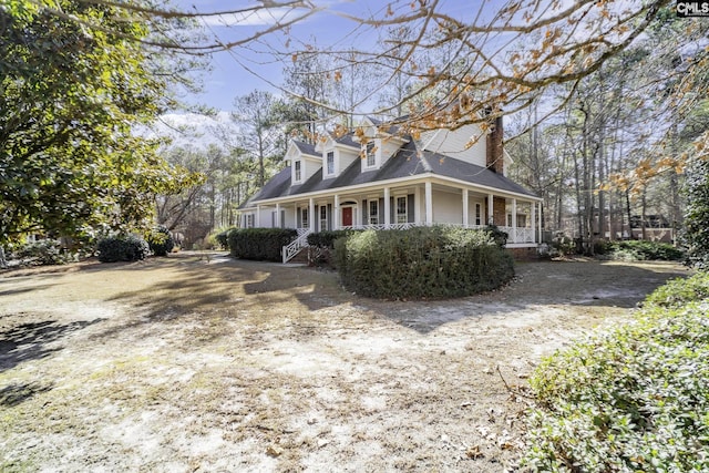 view of property exterior featuring covered porch