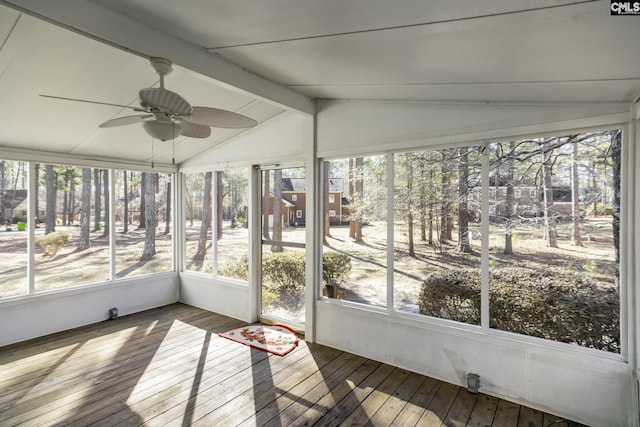 unfurnished sunroom with vaulted ceiling with beams and ceiling fan