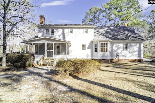 back of property featuring a sunroom