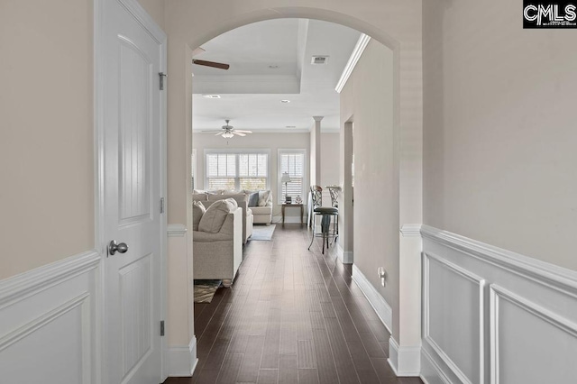 corridor featuring crown molding and dark wood-type flooring