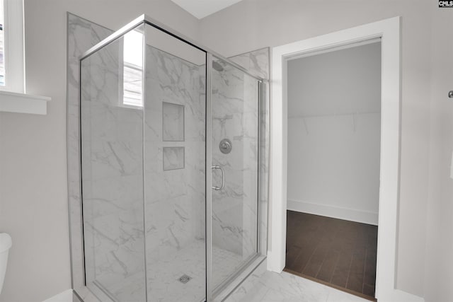 bathroom featuring an enclosed shower