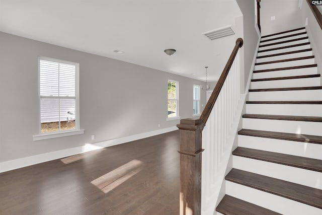 staircase featuring hardwood / wood-style flooring