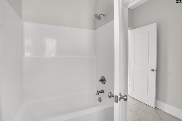 bathroom with shower / bath combination