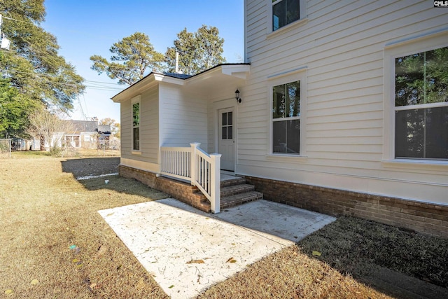 doorway to property featuring a patio