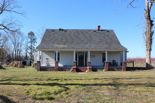 view of front of house featuring a porch and a front yard