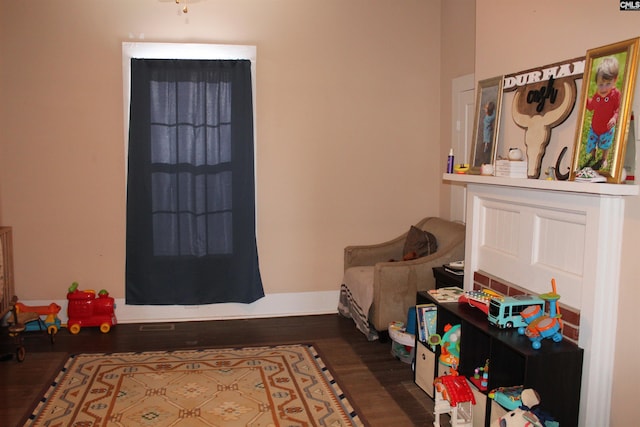 recreation room featuring dark hardwood / wood-style floors