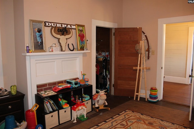 bedroom with dark hardwood / wood-style flooring