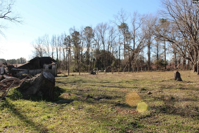 view of yard with a rural view