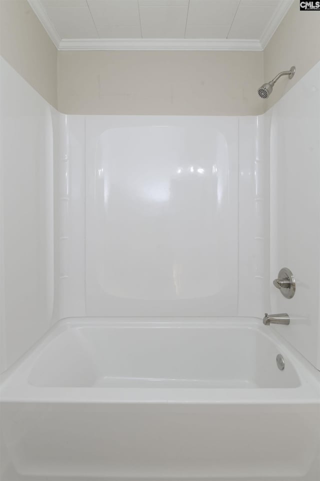 bathroom featuring crown molding and shower / bathing tub combination