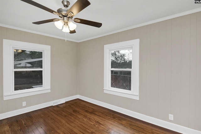 empty room featuring hardwood / wood-style flooring, ceiling fan, and ornamental molding