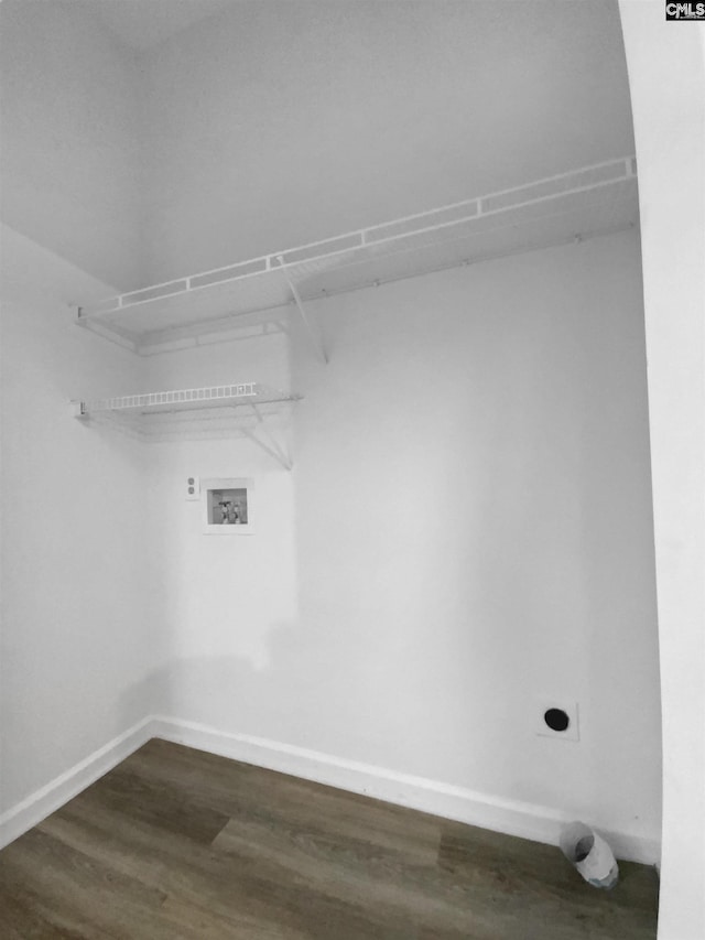 laundry area with hookup for a washing machine, dark hardwood / wood-style floors, and hookup for an electric dryer