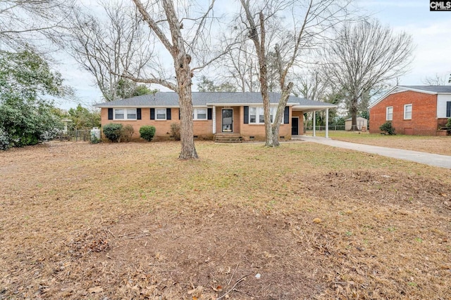 single story home featuring a carport