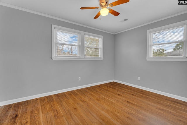 spare room featuring ceiling fan, crown molding, and hardwood / wood-style flooring