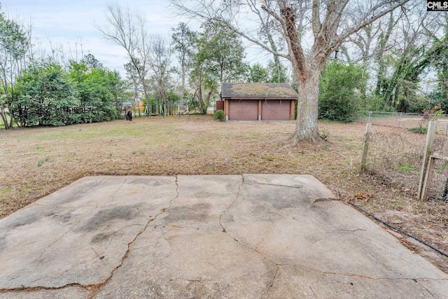 view of yard featuring an outbuilding and a patio