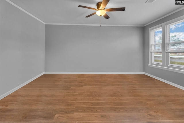 unfurnished room featuring ceiling fan, hardwood / wood-style floors, and ornamental molding