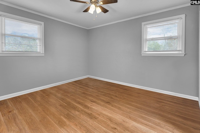 unfurnished room with crown molding, ceiling fan, and a healthy amount of sunlight