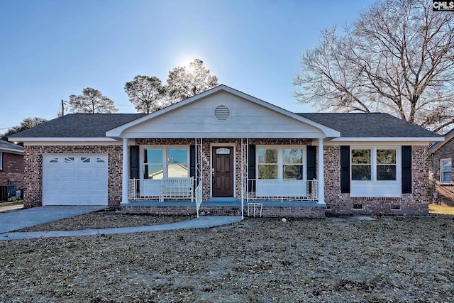 view of front of house with a garage and covered porch