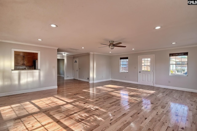 interior space featuring ceiling fan, light hardwood / wood-style floors, and crown molding