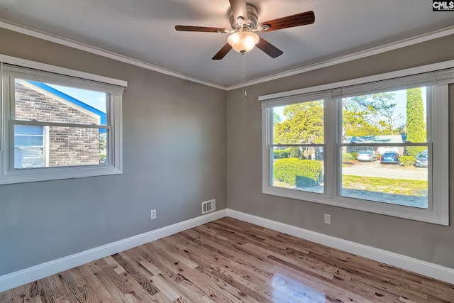 unfurnished room featuring light wood-type flooring, ceiling fan, and crown molding