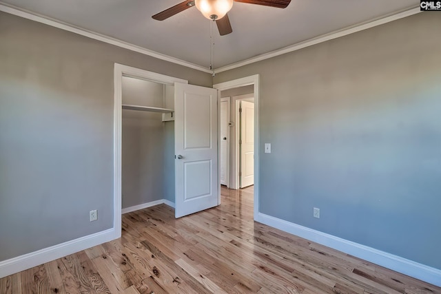 unfurnished bedroom featuring a closet, ceiling fan, ornamental molding, and light hardwood / wood-style floors