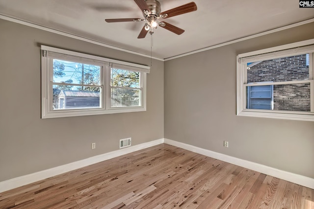 unfurnished room with light hardwood / wood-style flooring, ceiling fan, and crown molding