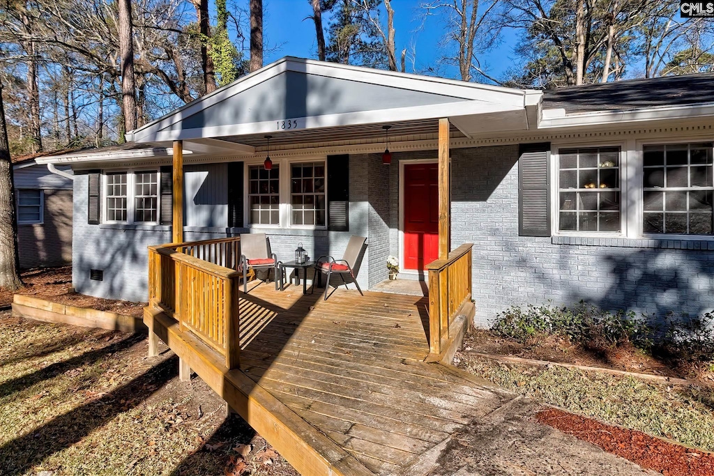 wooden deck featuring a porch