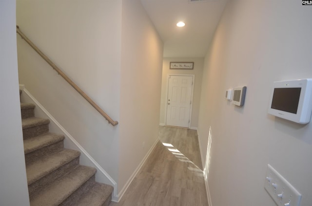 stairway featuring hardwood / wood-style flooring