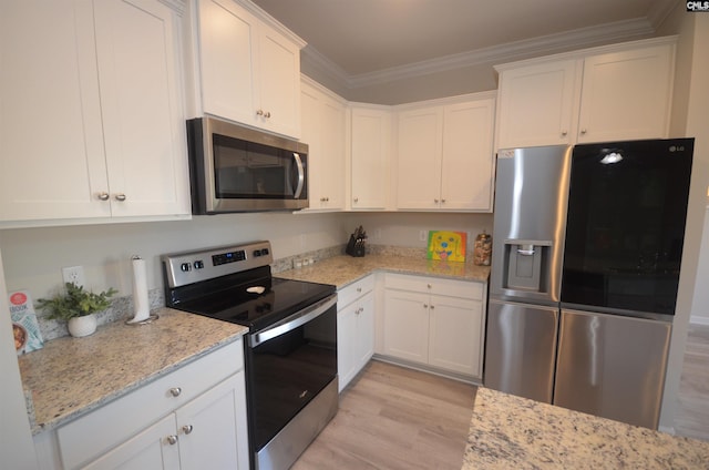 kitchen with light stone countertops, white cabinetry, ornamental molding, and appliances with stainless steel finishes