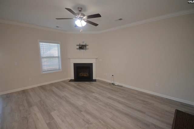 unfurnished living room with ceiling fan, light hardwood / wood-style floors, and ornamental molding