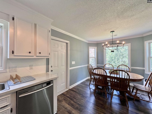 dining space with dark hardwood / wood-style flooring, a chandelier, a textured ceiling, and ornamental molding